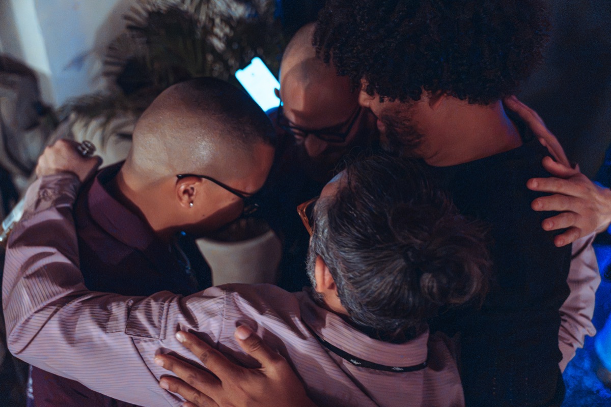 The band huddled in a circle together before going on
