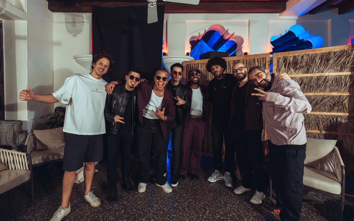The band and crew lined up for a group photo
