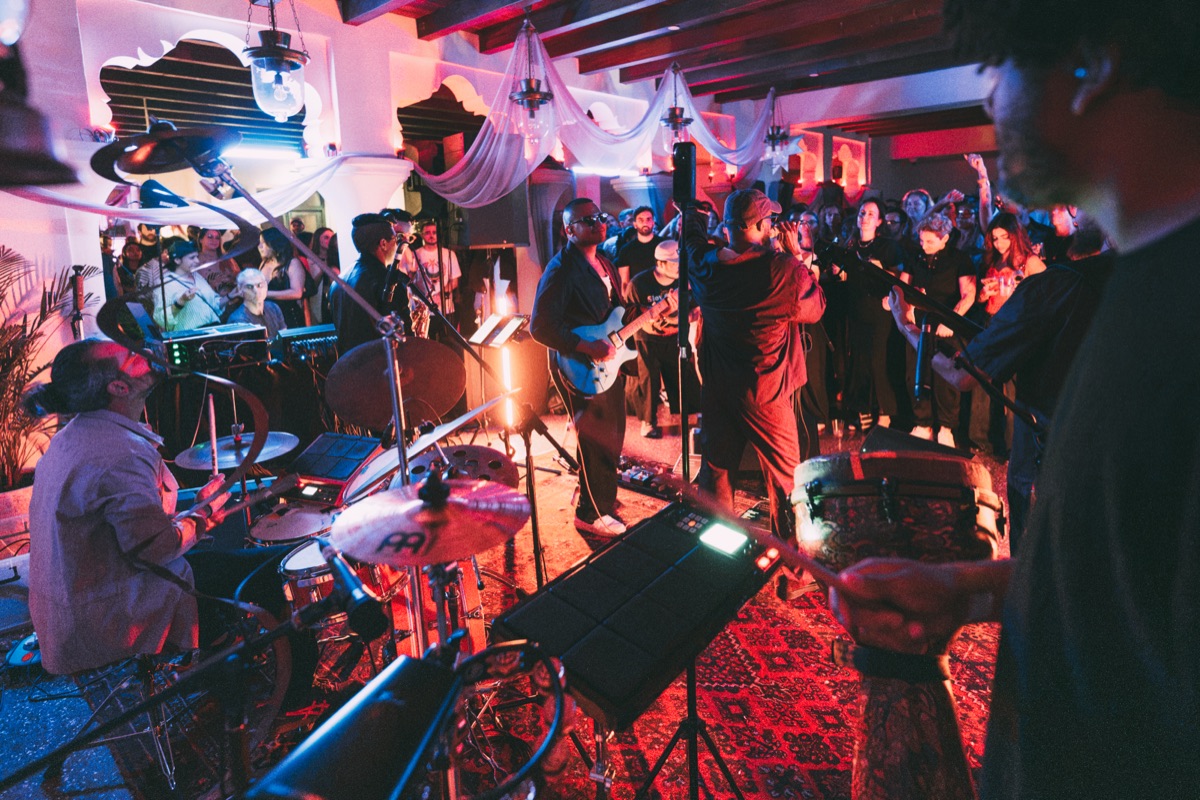 The full band playing, the crowd pressed in close