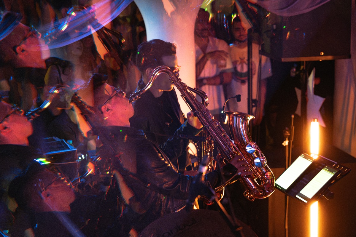 A saxophone solo under blue light