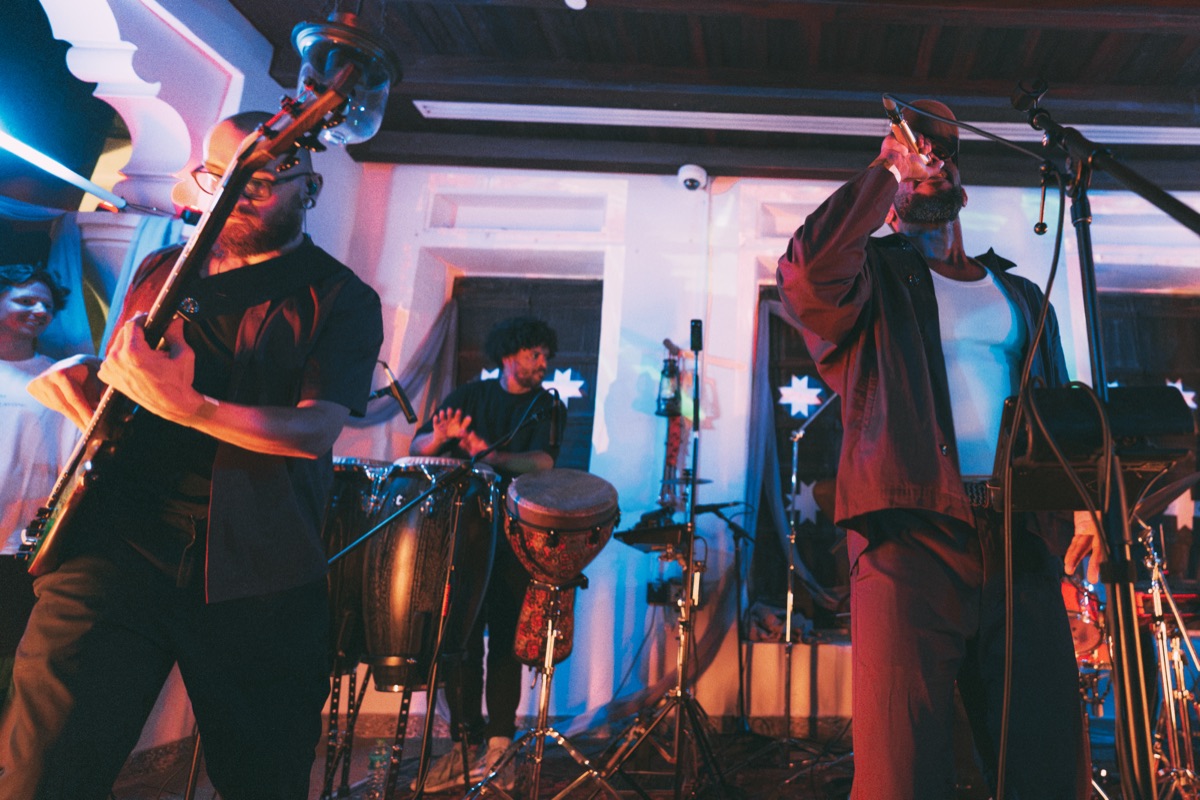 Trombone and vocals, congas behind