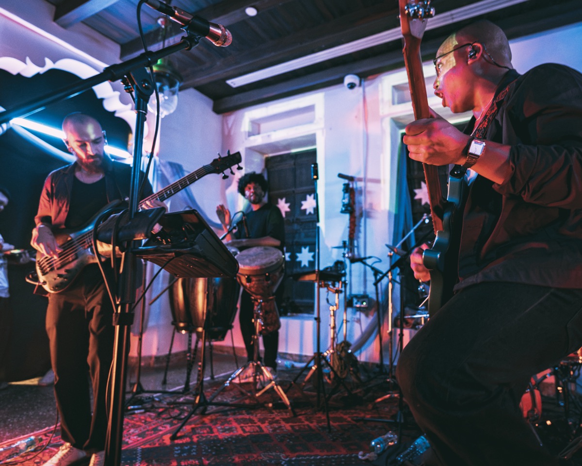 Bass, drums and guitar across the width of the stage