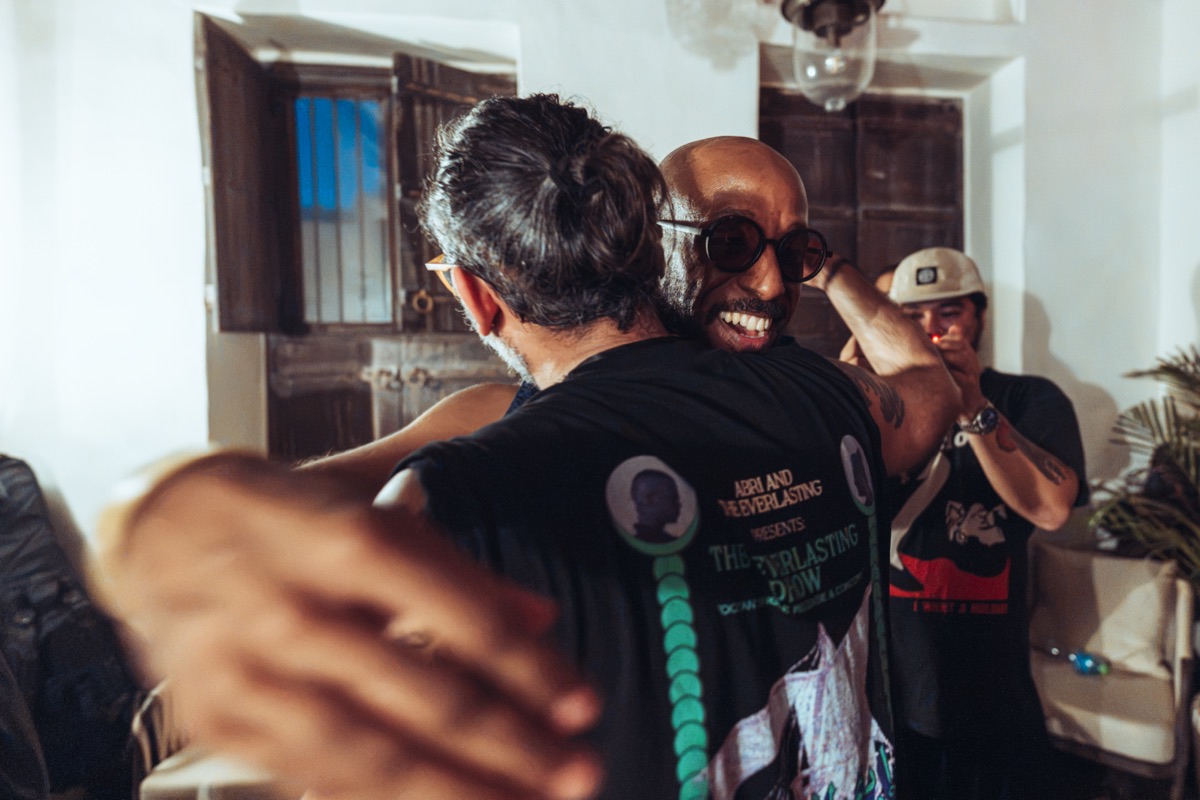 Two of the band hugging after the show