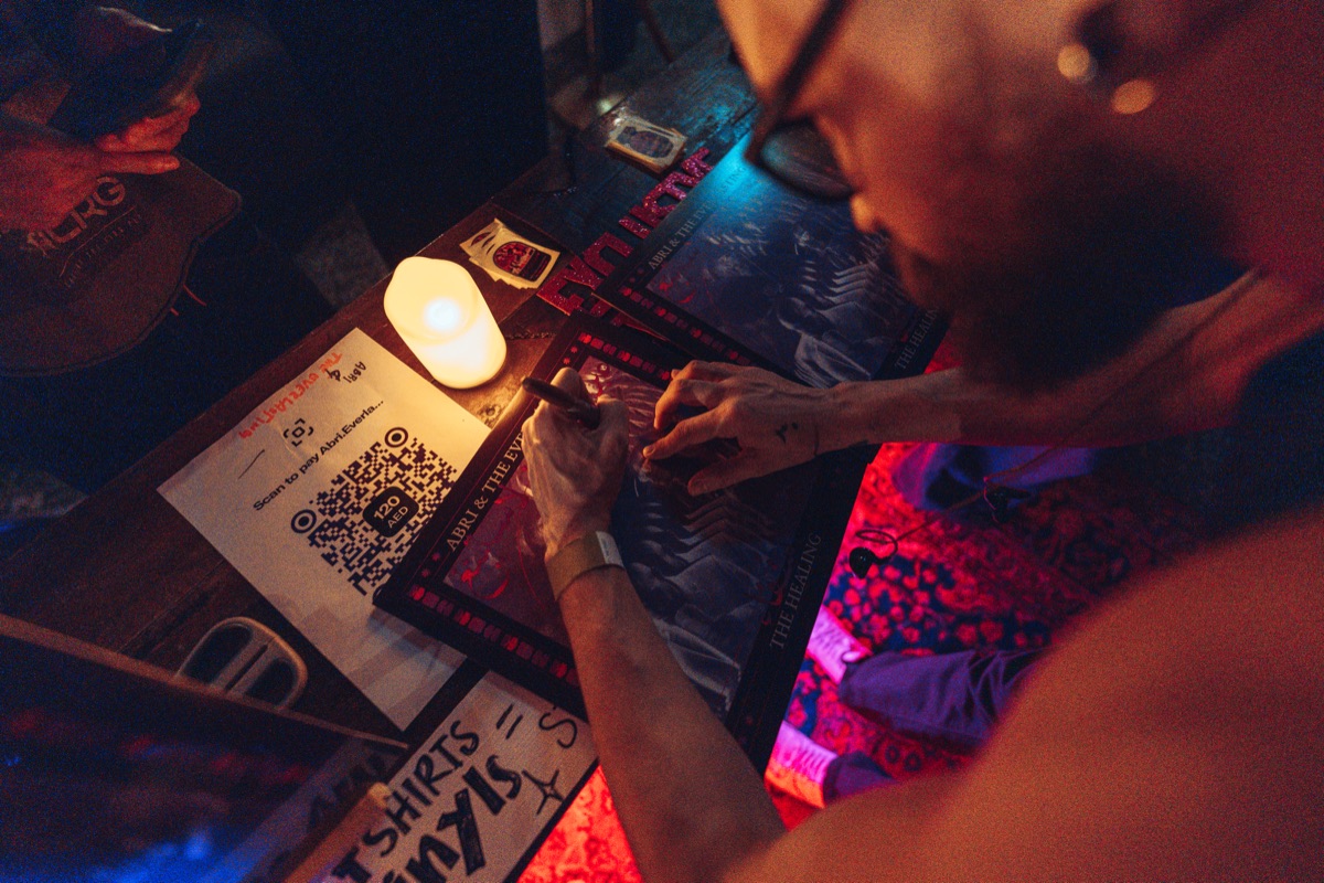 Signing prints at the end of the night